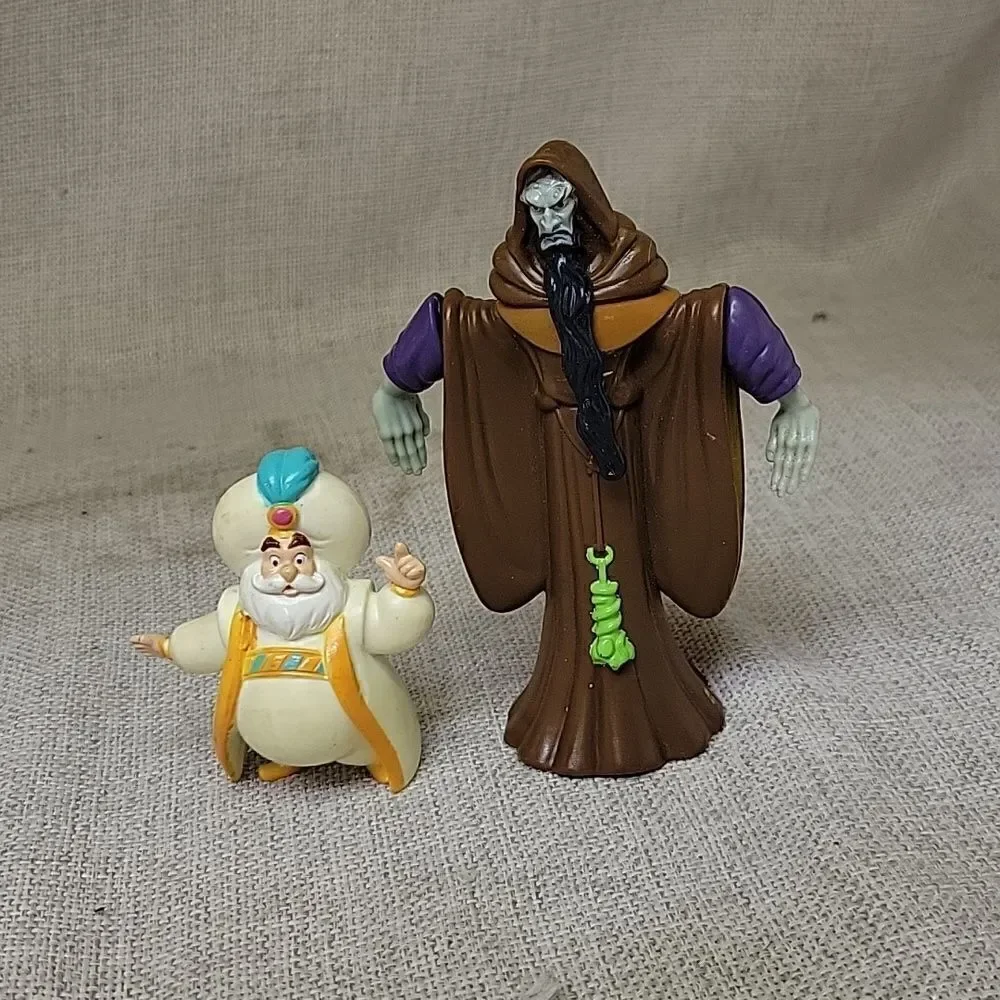 Disney Aladdin and Jafar VHS movies, book and puzzle and figures‎